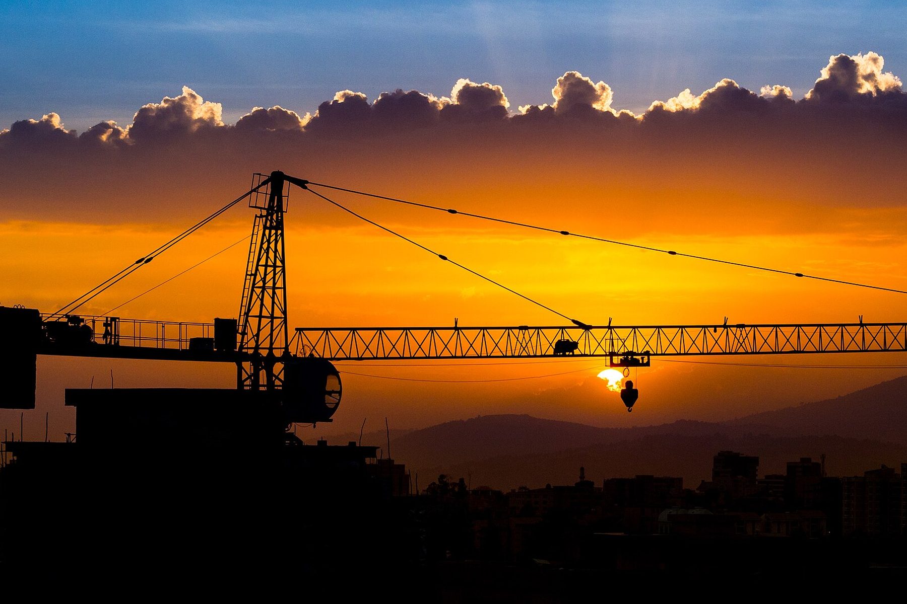 A construction crane over Addis Ababa at sunset