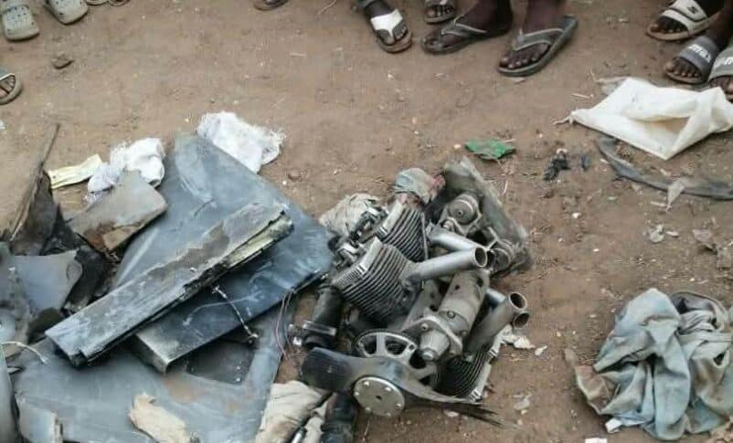 Wreckage from an intercepted drone lies among debris on the ground